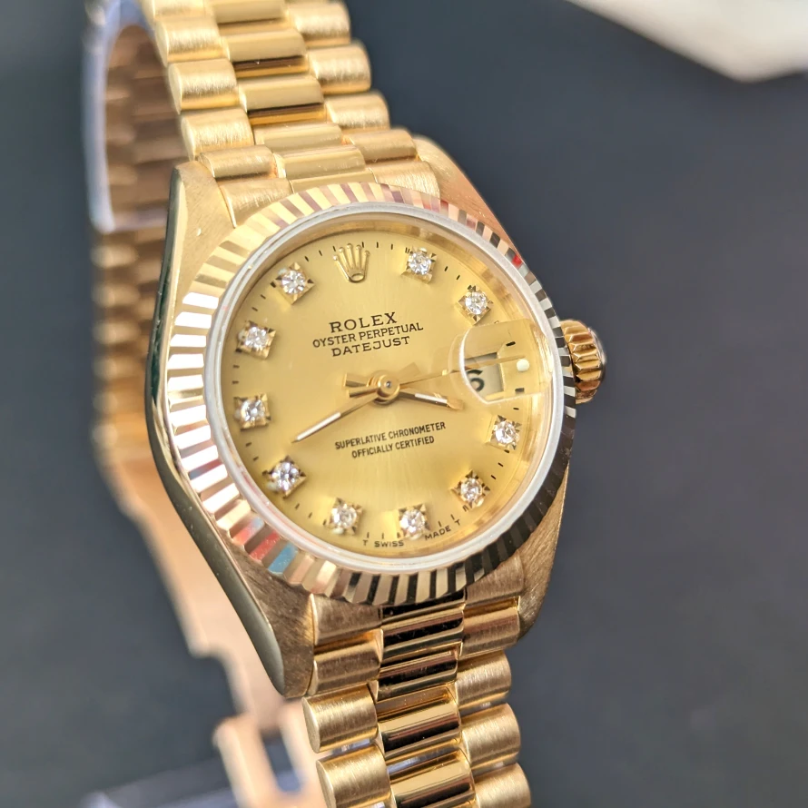 Ladys diamond dial gold Rolex front