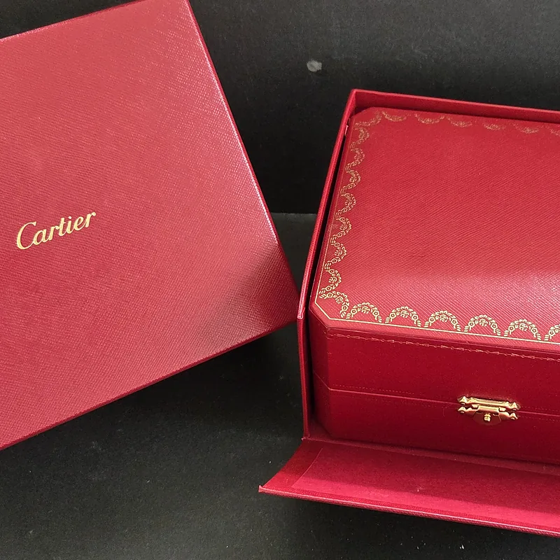 Cartier Tank Francaise ref. 2384, ivory dial featuring black roman numeral hour markers and blue hands - dial close-up