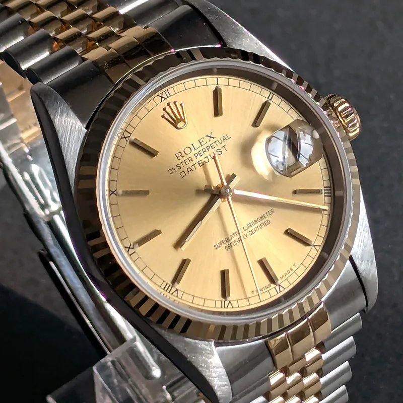Rolex DateJust 36mm ref. 16233, champagne with gold baton hour markers - front view