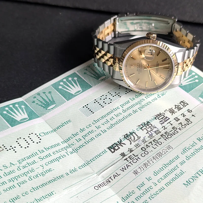Rolex DateJust 36mm ref. 16233, champagne with gold baton hour markers - bracelet