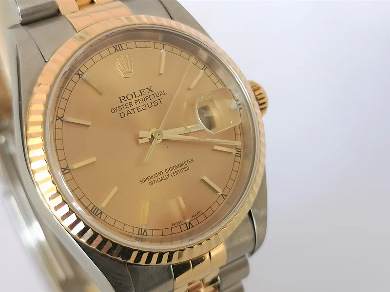 Rolex DateJust 36mm ref. 16233, champagne with gold baton hour markers - front view