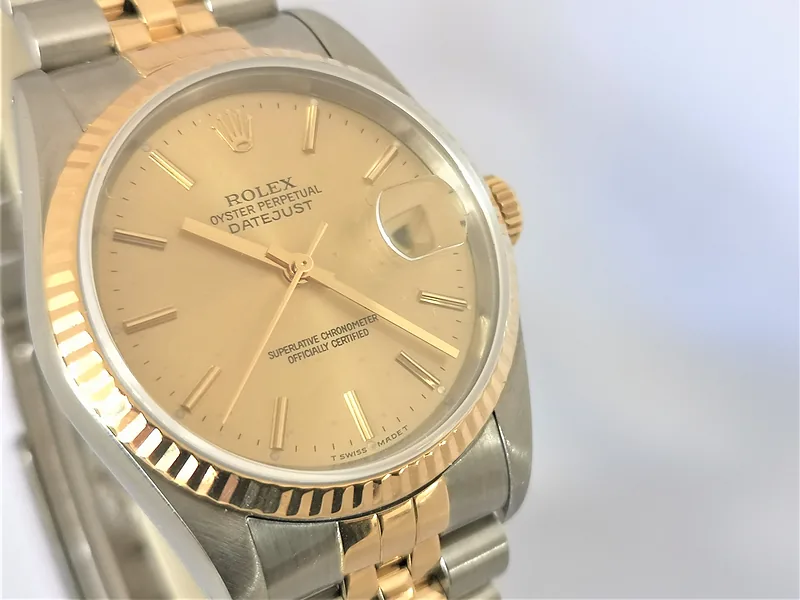 Rolex DateJust 36mm ref. 16233, champagne with gold baton hour markers - front view