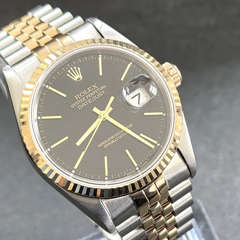 Rolex DateJust 36mm ref. 16233, black with gold baton hour markers - dial close-up
