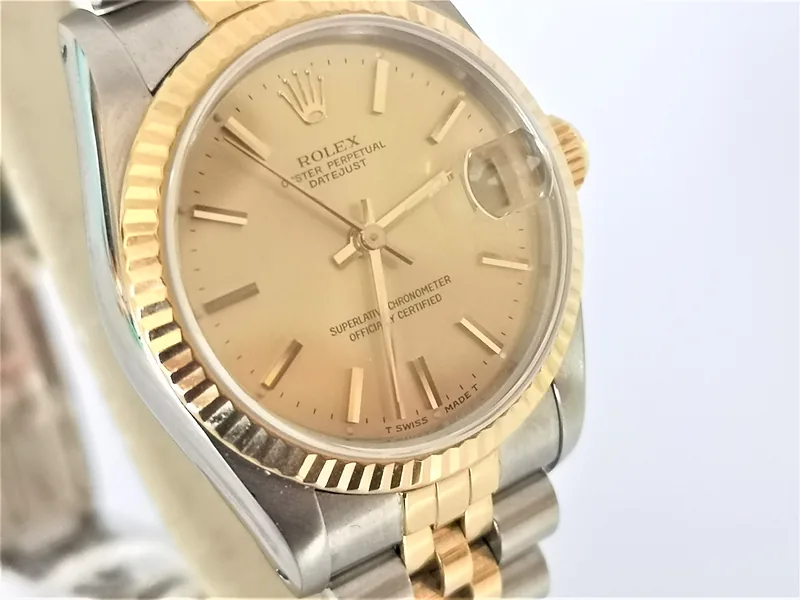 Rolex DateJust 31mm ref. 68273, champagne with gold batons - front view