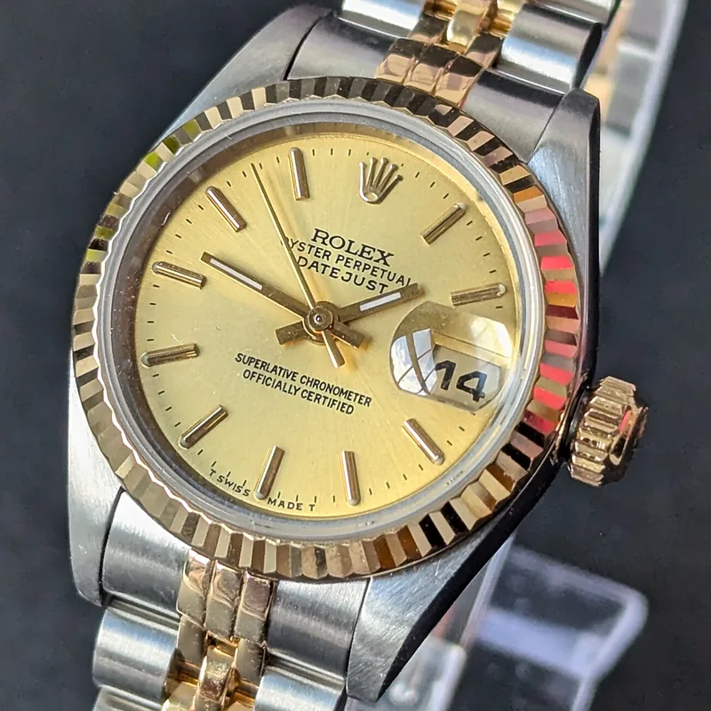 Rolex DateJust 26mm ref. 69173, champagne with gold baton hour markers - front view