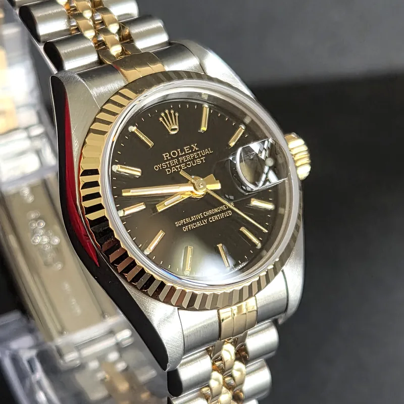Rolex DateJust 26mm ref. 79173, black with gold batons - front view