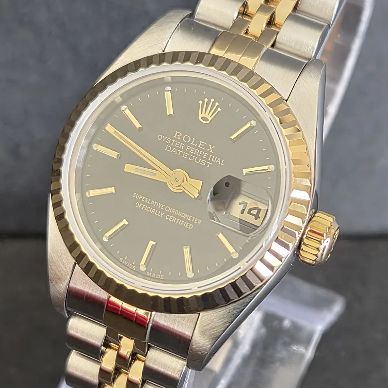 Rolex DateJust 26mm ref. 79173, black with gold batons - dial close-up