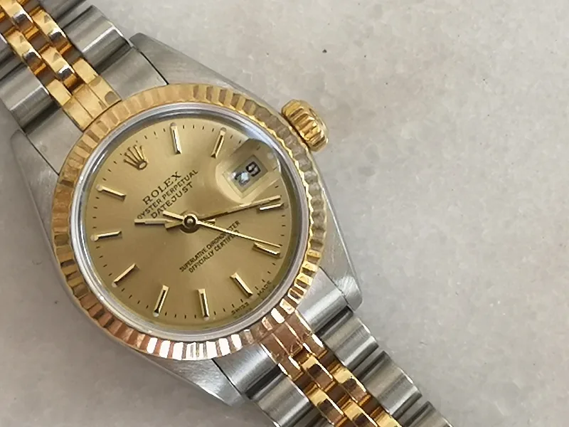 Rolex DateJust 26mm ref. 79173, champagne with gold baton hour markers - front view