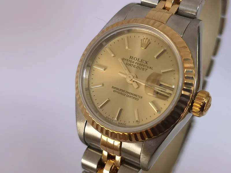 Rolex DateJust 26mm ref. 79173, champagne with gold baton hour markers - crown and case