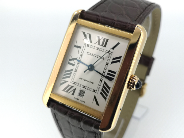 Rose gold Cartier watch dial