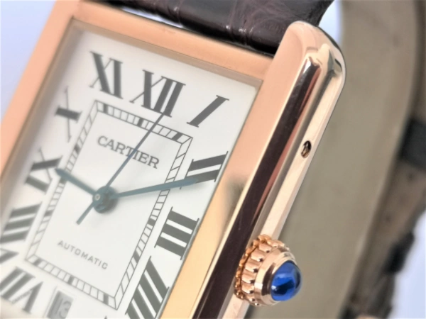 Rose gold Cartier watch crown