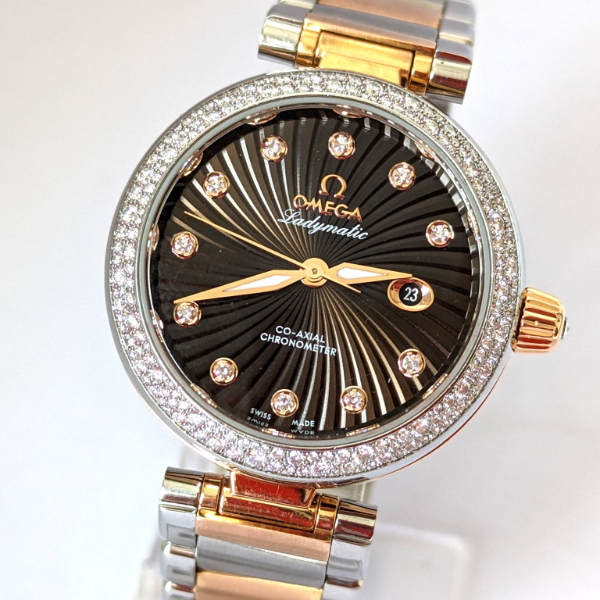 Omega Ladymatic with diamond bezel and dial side