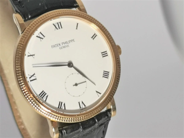 Gold Calatrava with papers front