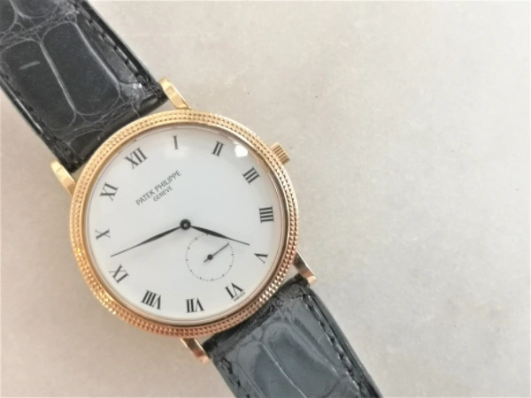 Gold Calatrava with papers crown