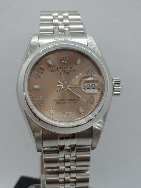 A more distinctive Ladies Rolex Date with Salmon dial. crown