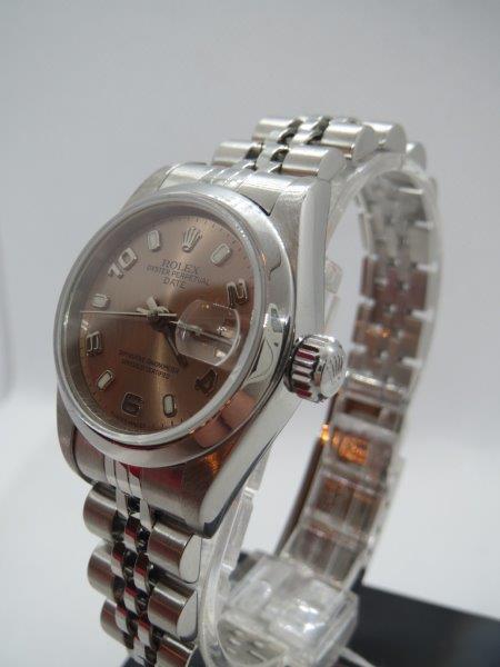 A more distinctive Ladies Rolex Date with Salmon dial. bracelet