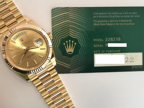 Gold Rolex Day-Date 40 with Full Set clasp