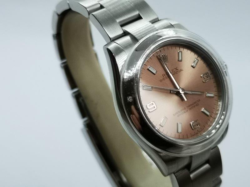 A modern Rolex DateJust in 31mm of pretty pink. dial