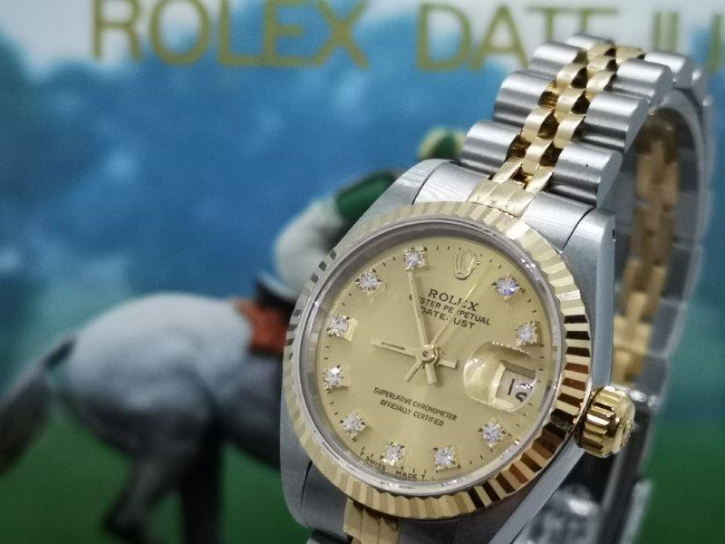 Rolex Datejust with Champagne and original diamond dot dial bracelet