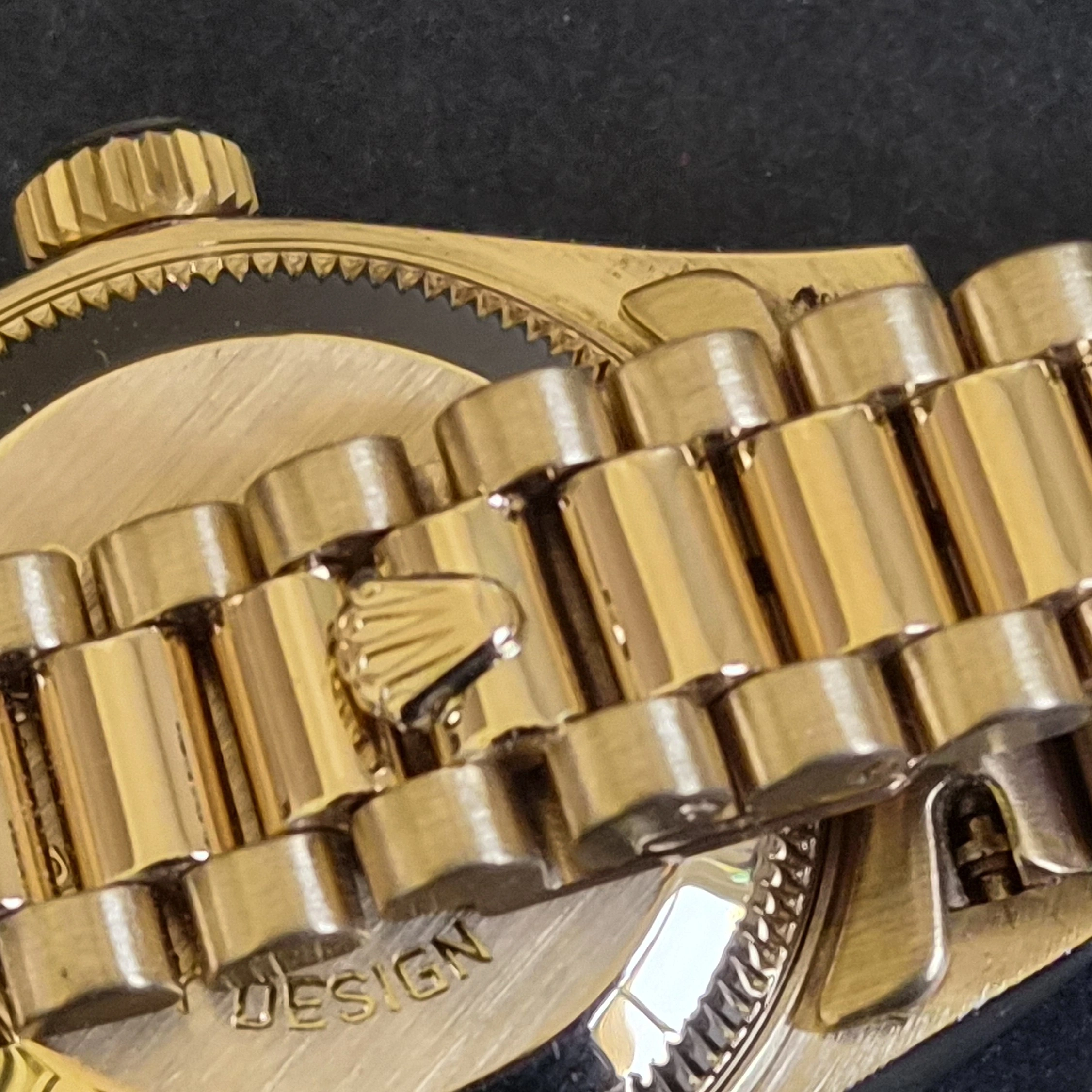  Gold DateJust on President Bracelet crown