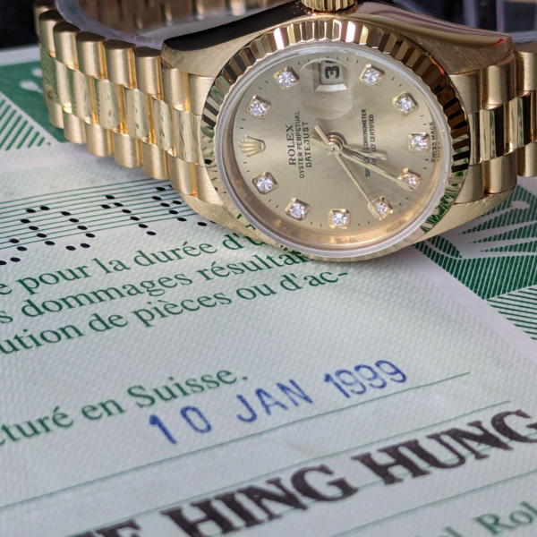 Lady's gold Rolex with Diamonds crown