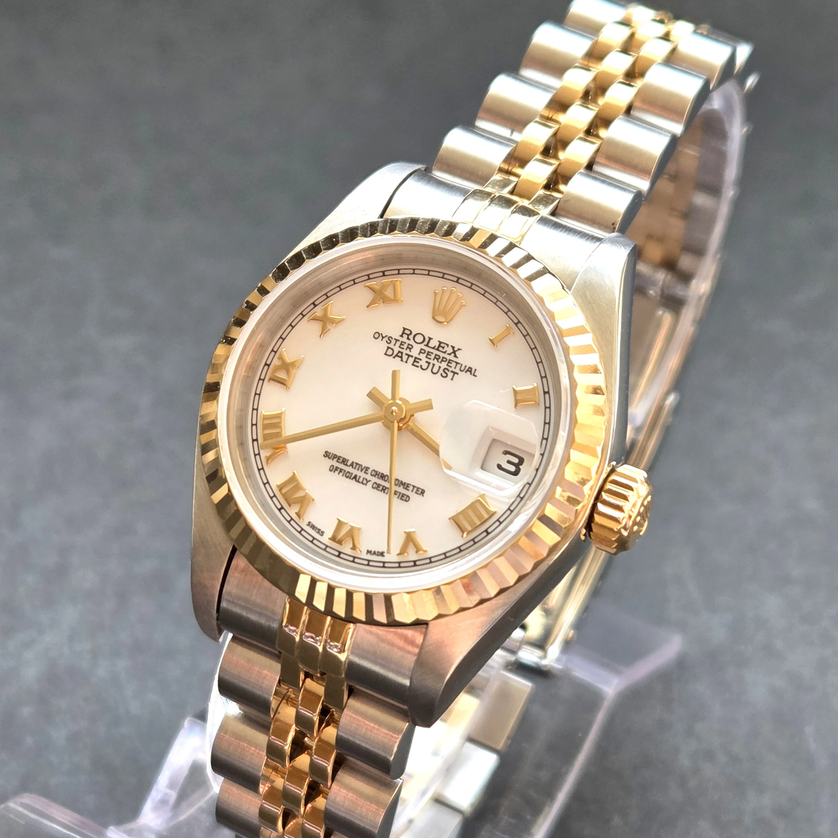 Gold Roman Numerals on crisp White Dial   front