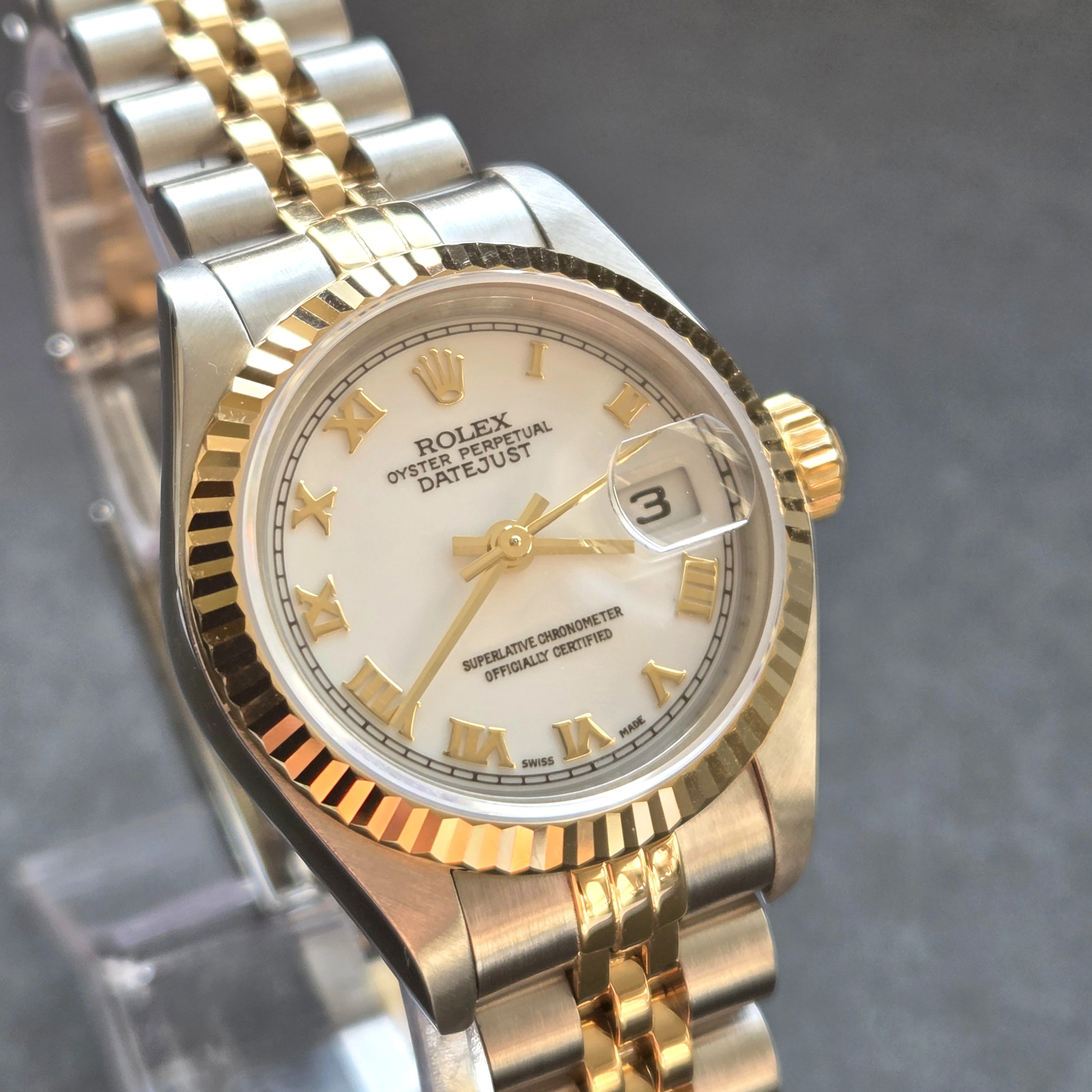 Gold Roman Numerals on crisp White Dial   dial