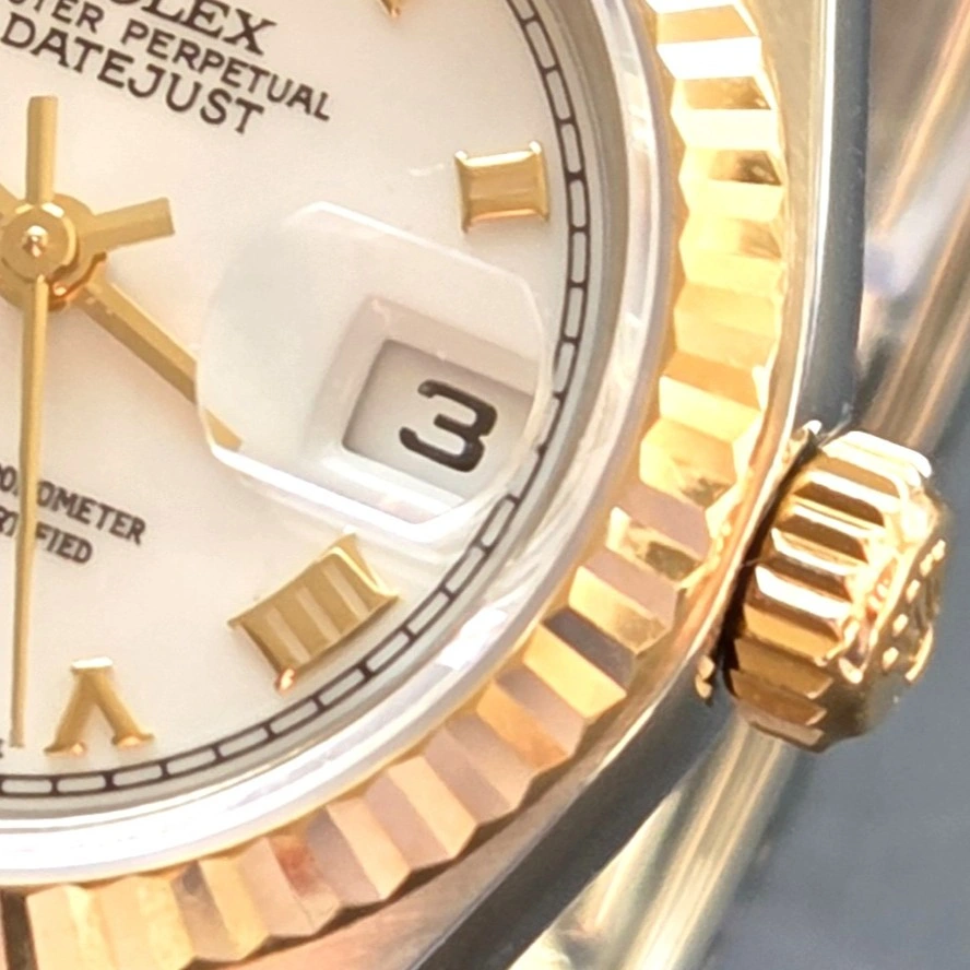 Gold Roman Numerals on crisp White Dial   crown