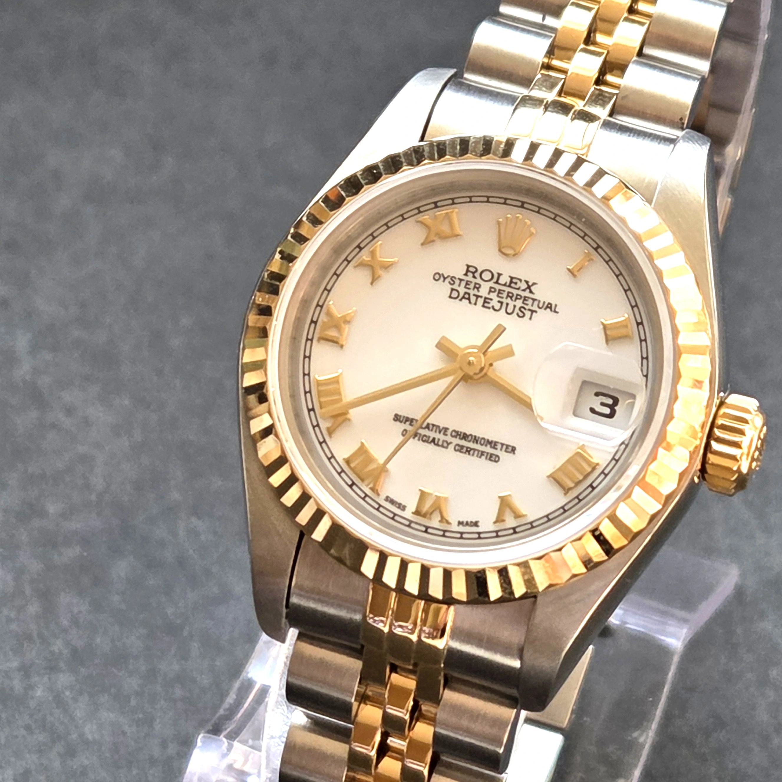 Gold Roman Numerals on crisp White Dial   clasp